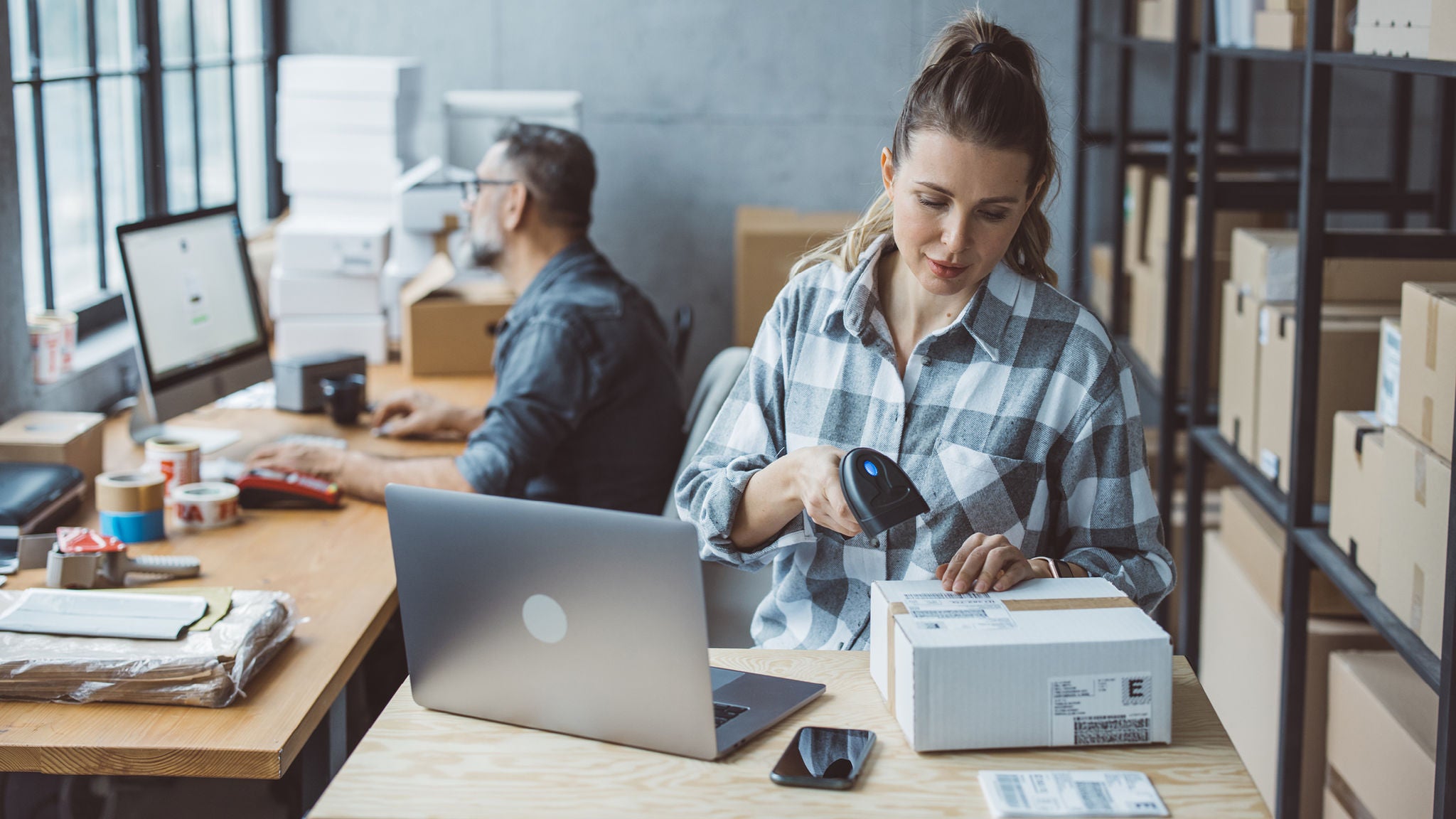 photo-woman-man-packing-scanning-parcels-warehouse-small-business