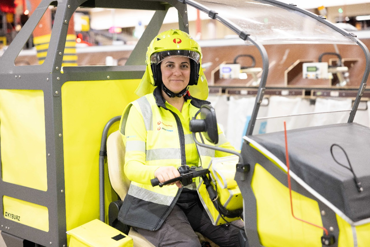 A postie sitting in a EDV
