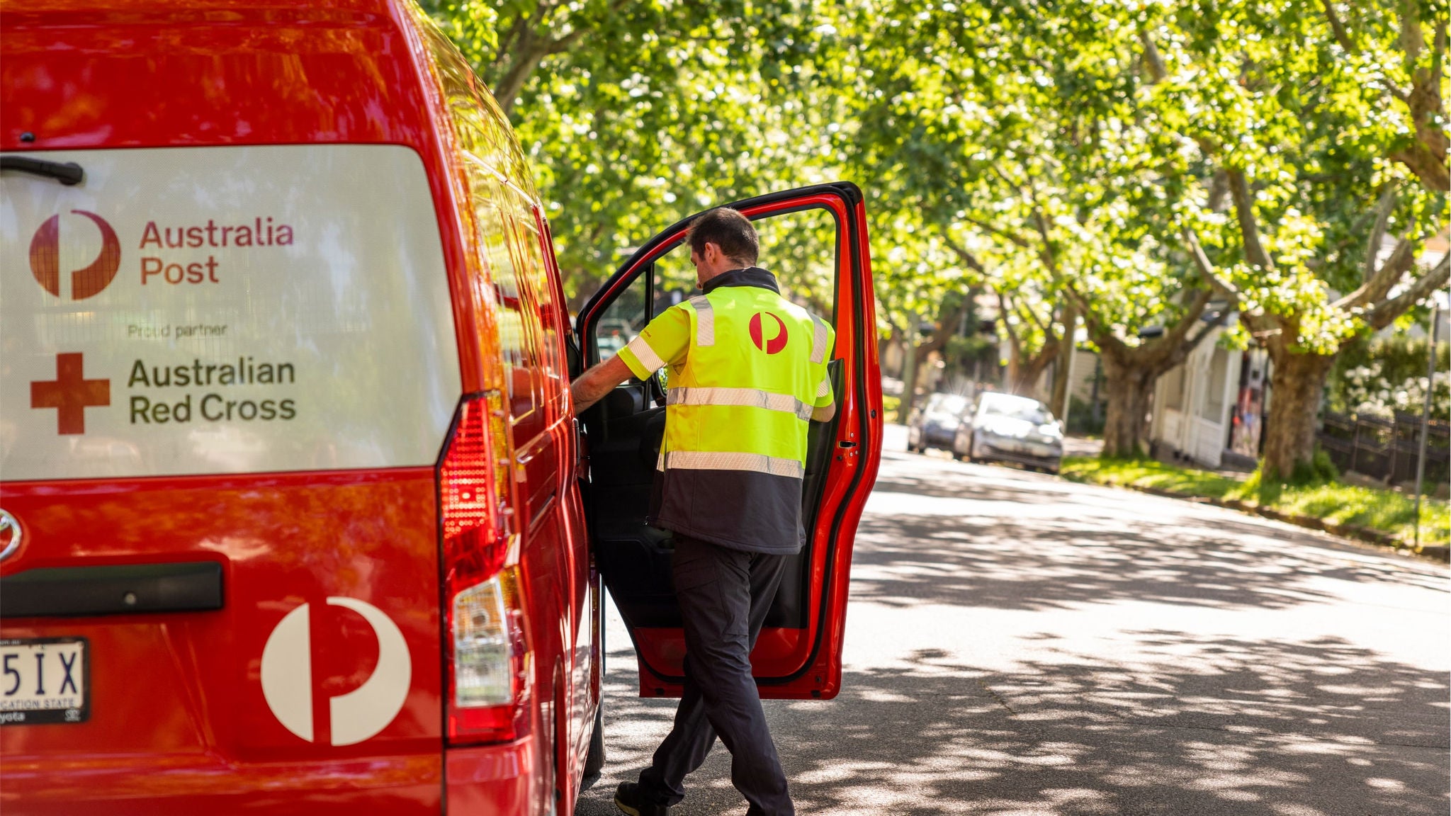 A man getting into a delivery van