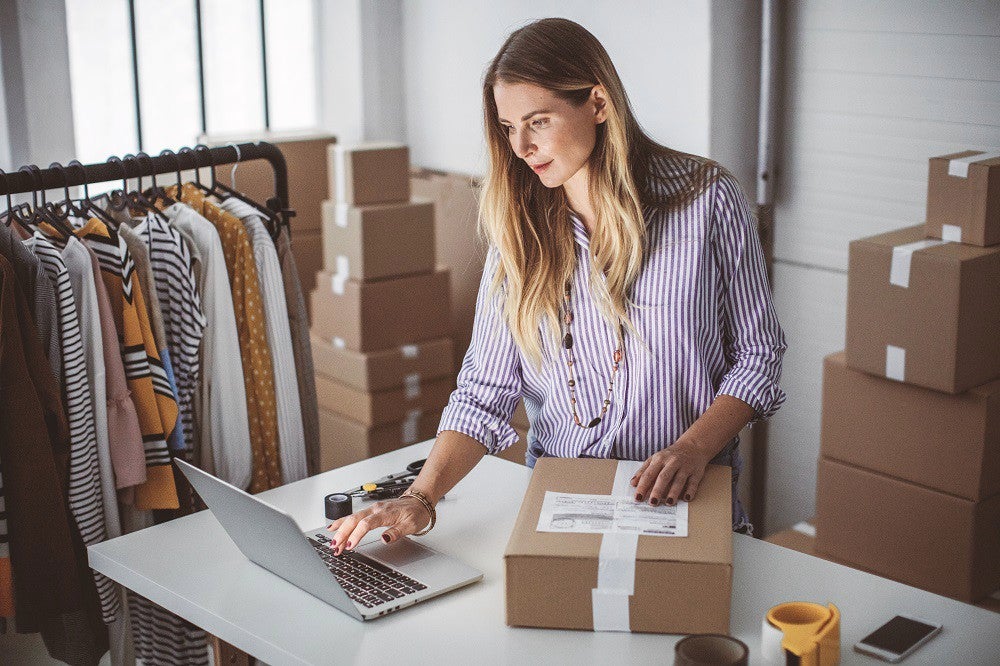 photo-woman-clothes-parcels-laptop-small-business